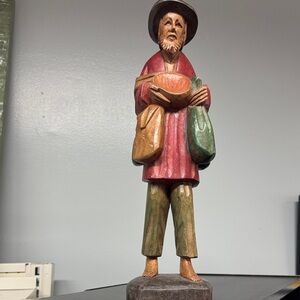 Handcrafted Wooden Figurine with Red and Green Accents